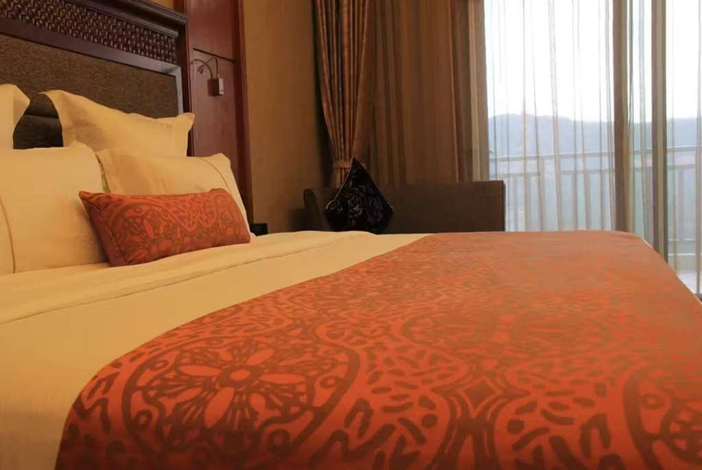 Отель Ramada Plaza Xishuangbanna Номер фото