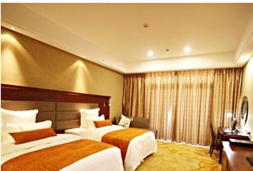 Отель Ramada Plaza Xishuangbanna Экстерьер фото